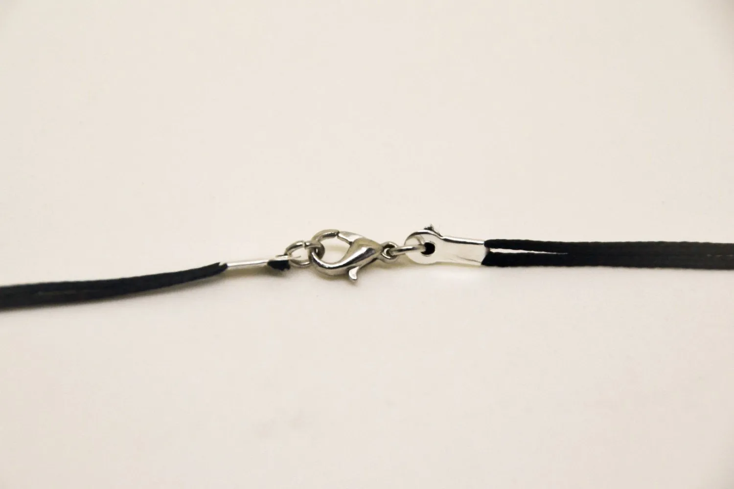 Silver Infinity necklace for men, blue cord